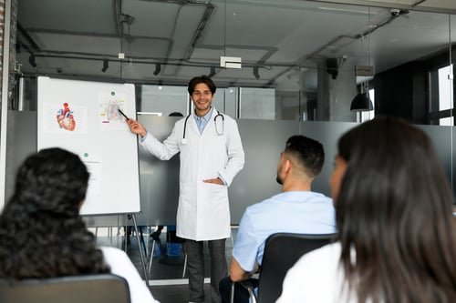 Clinical faculty sharing knowledge with healthcare professionals