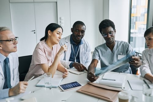 Healthcare leaders collaborating around a table